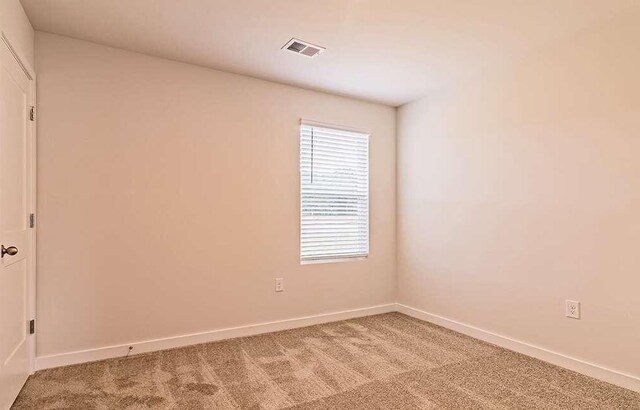 empty room featuring carpet flooring