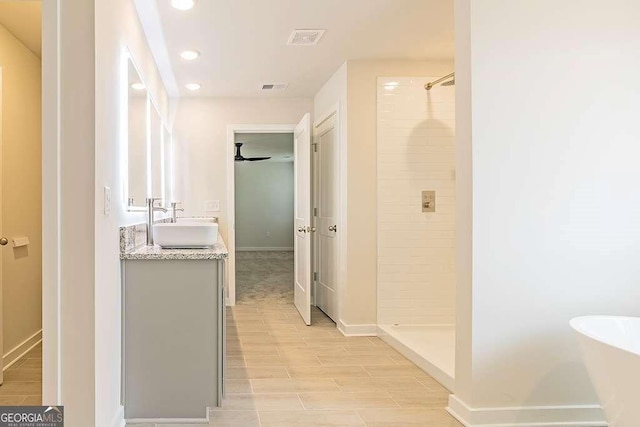 bathroom with vanity and plus walk in shower