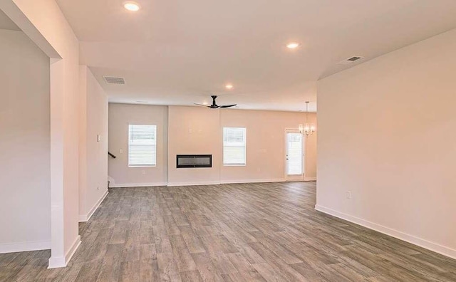 unfurnished living room featuring hardwood / wood-style floors and ceiling fan