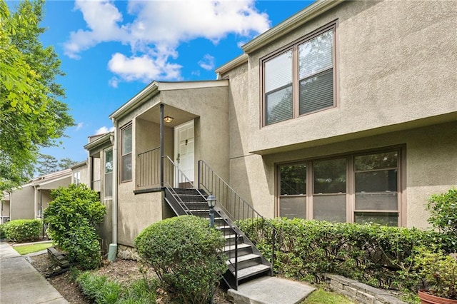 1719 Woodcliff Ct NE, Atlanta, GA 30329 - doorway to property featuring stucco siding