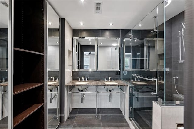 1719 Woodcliff Ct NE, Atlanta, GA 30329 - bathroom with a stall shower, double vanity, recessed lighting, and decorative backsplash