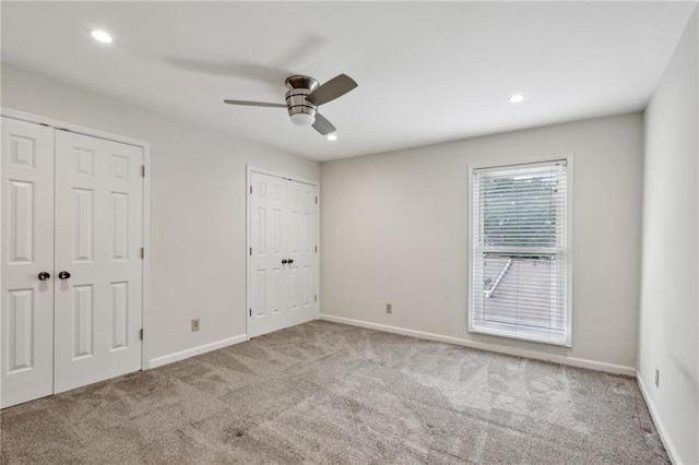 1719 Woodcliff Ct NE, Atlanta, GA 30329 - unfurnished bedroom featuring multiple closets, carpet flooring, baseboards, recessed lighting, and ceiling fan