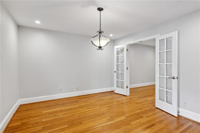 1719 Woodcliff Ct NE, Atlanta, GA 30329 - empty room with french doors, light wood finished floors, baseboards, and recessed lighting