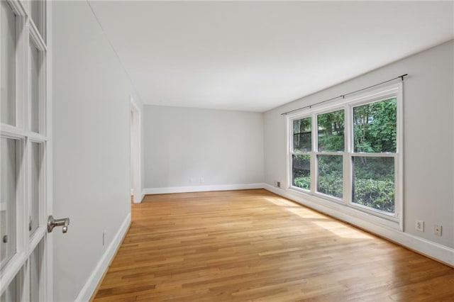 1719 Woodcliff Ct NE, Atlanta, GA 30329 - empty room with light wood-style flooring and baseboards
