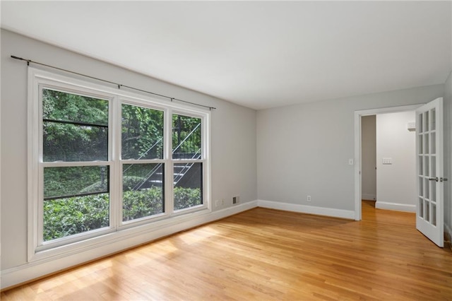1719 Woodcliff Ct NE, Atlanta, GA 30329 - spare room featuring baseboards and light wood finished floors