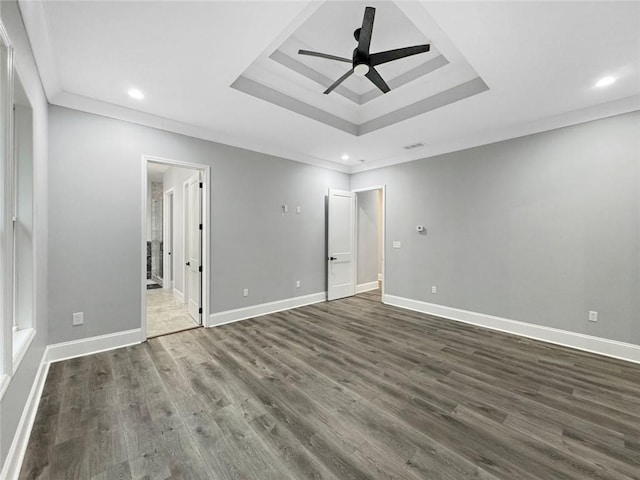 244 Coastline Rd, Fayetteville, GA 30214 - unfurnished bedroom featuring recessed lighting, dark wood-type flooring, a raised ceiling, baseboards, and ensuite bath