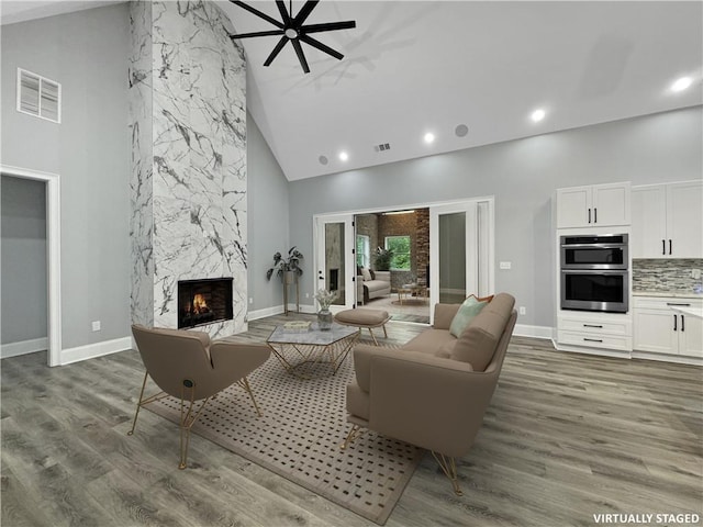 244 Coastline Rd, Fayetteville, GA 30214 - living room with high vaulted ceiling, a fireplace, recessed lighting, wood finished floors, and baseboards