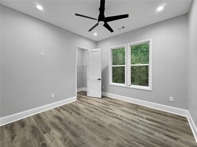 244 Coastline Rd, Fayetteville, GA 30214 - unfurnished bedroom with baseboards, wood finished floors, recessed lighting, a walk in closet, and ceiling fan