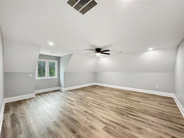 244 Coastline Rd, Fayetteville, GA 30214 - additional living space featuring wood finished floors, vaulted ceiling, a ceiling fan, baseboards, and recessed lighting