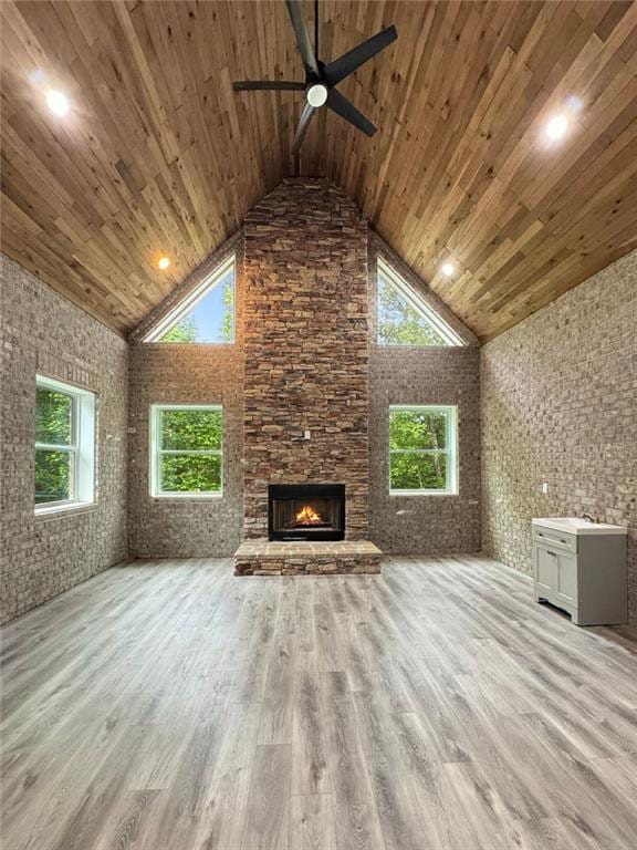244 Coastline Rd, Fayetteville, GA 30214 - unfurnished living room featuring high vaulted ceiling, a ceiling fan, wood ceiling, light wood-type flooring, and an outdoor stone fireplace