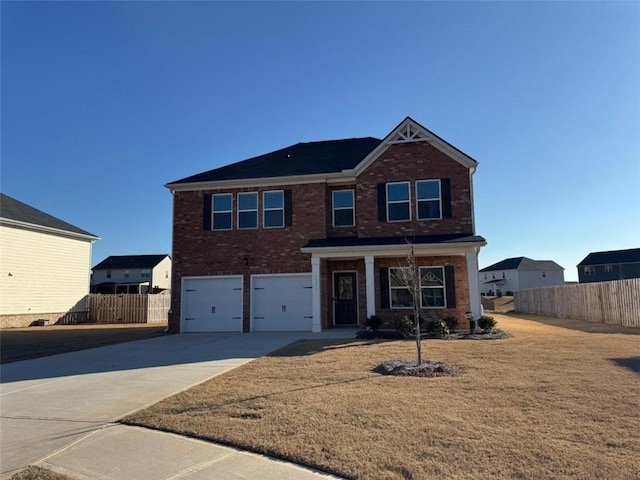 view of front of house with driveway, a garage, fence, and brick siding