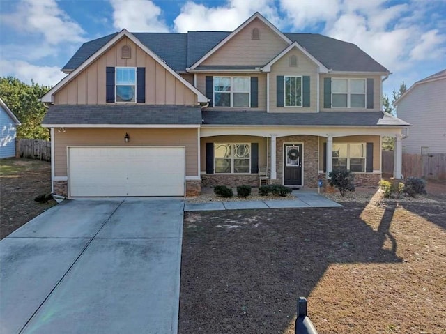 craftsman inspired home with a porch and a garage