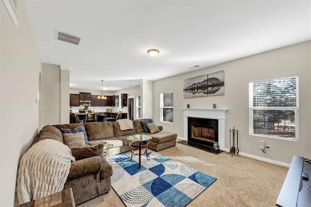 living room featuring light colored carpet