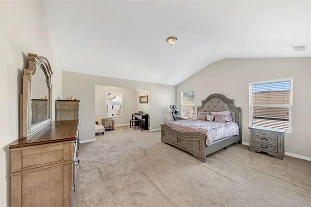 carpeted bedroom with vaulted ceiling