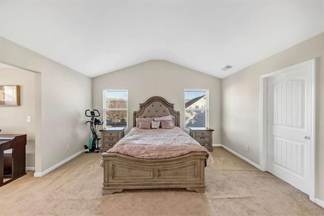 carpeted bedroom featuring multiple windows and lofted ceiling