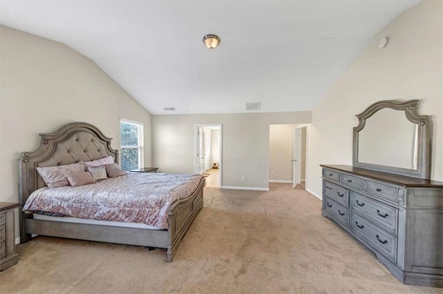 carpeted bedroom featuring lofted ceiling