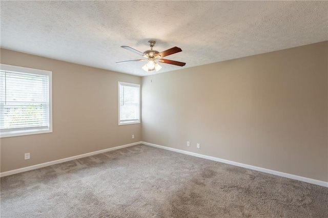 225 Fireside Way, Fairburn, GA 30213 - carpeted empty room with ceiling fan, baseboards, and a textured ceiling