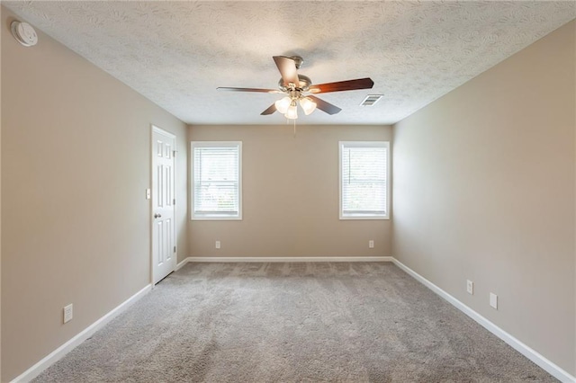 225 Fireside Way, Fairburn, GA 30213 - carpeted empty room with ceiling fan, a smoke detector, baseboards, and a textured ceiling