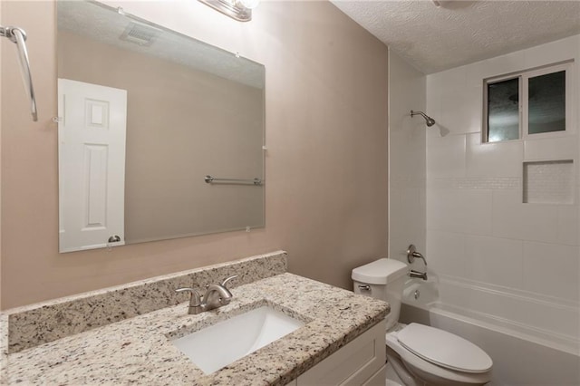 225 Fireside Way, Fairburn, GA 30213 - bathroom featuring a textured ceiling, toilet, vanity, and shower / washtub combination