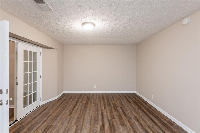 225 Fireside Way, Fairburn, GA 30213 - unfurnished room with wood finished floors, a textured ceiling, baseboards, and a smoke detector