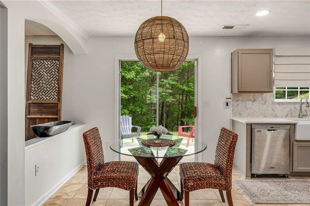 dining area featuring visible vents, recessed lighting, a textured ceiling, and light tile patterned floors