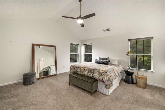 bedroom with carpet flooring, baseboards, visible vents, and lofted ceiling