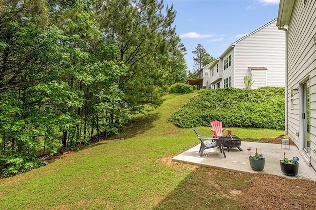 view of yard featuring a fire pit and a patio area