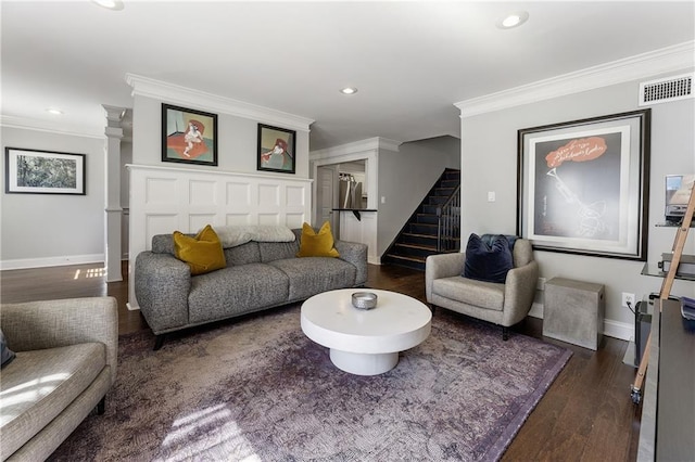 living room with visible vents, baseboards, stairs, dark wood-style floors, and crown molding