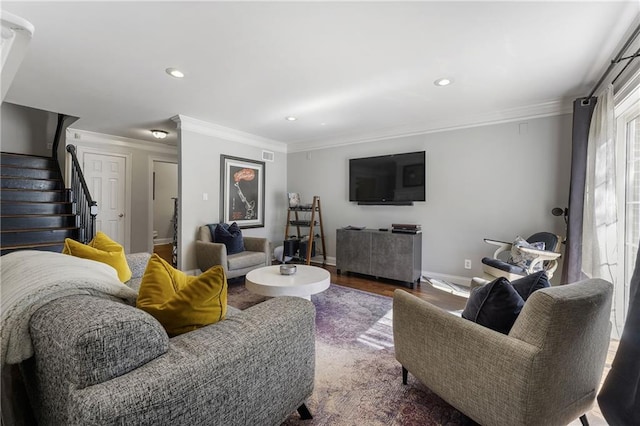 living room with stairs, baseboards, crown molding, and wood finished floors