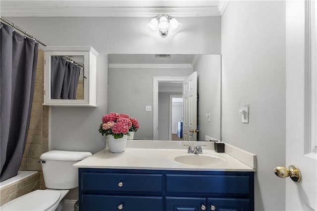 bathroom with visible vents, toilet, tiled shower / bath, crown molding, and vanity