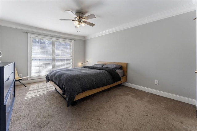 bedroom with carpet floors, baseboards, ornamental molding, and ceiling fan