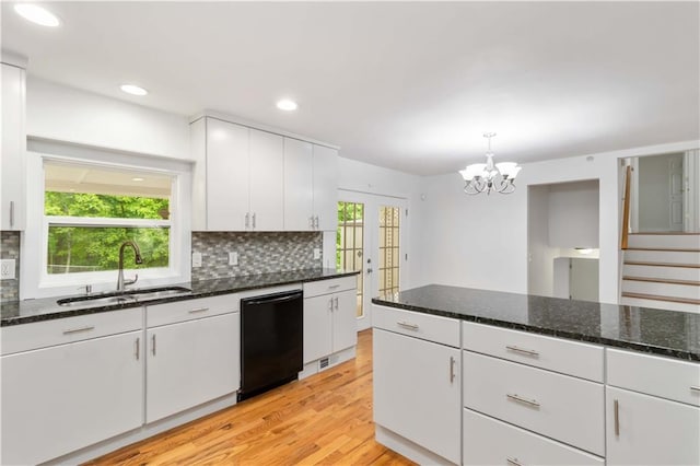 3781 Cherokee Trl, Suwanee, GA 30024 - kitchen featuring light wood-style flooring, tasteful backsplash, a sink, and dishwasher