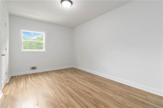 3781 Cherokee Trl, Suwanee, GA 30024 - empty room featuring baseboards, light wood-style flooring, and visible vents