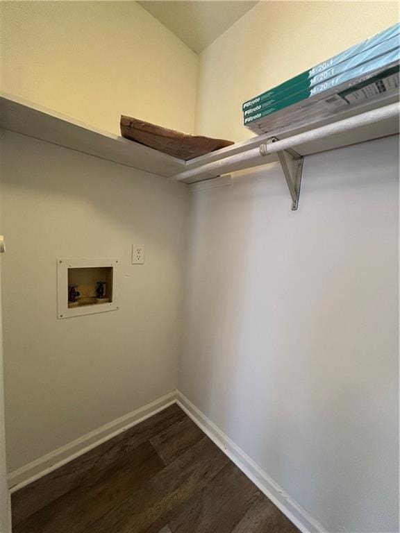 laundry area with dark hardwood / wood-style floors and hookup for a washing machine