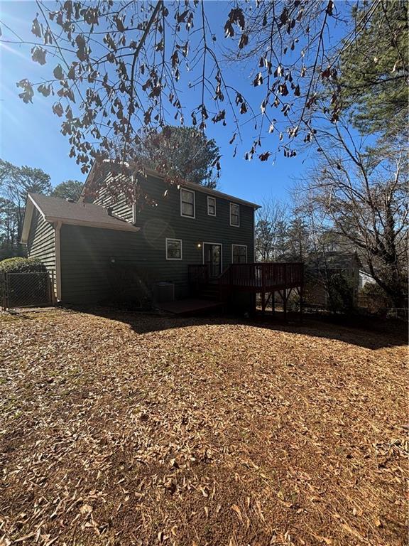 rear view of property with a deck