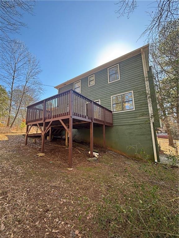 rear view of house with a wooden deck