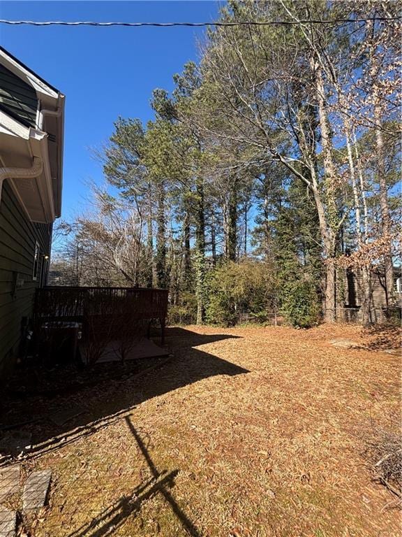 view of yard with a wooden deck