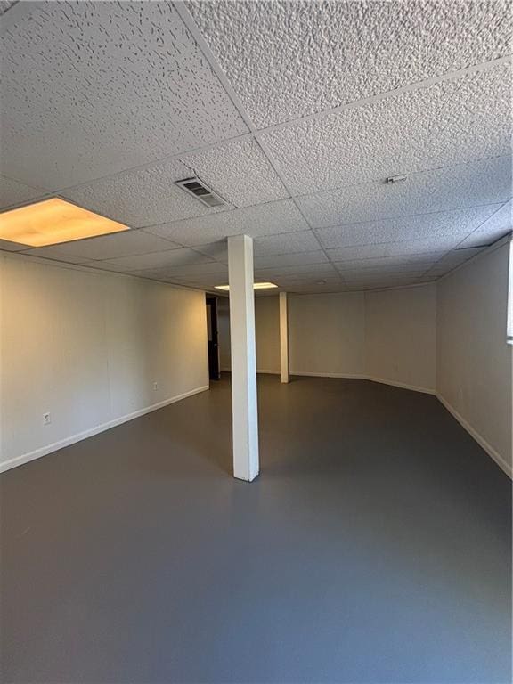 basement featuring a drop ceiling