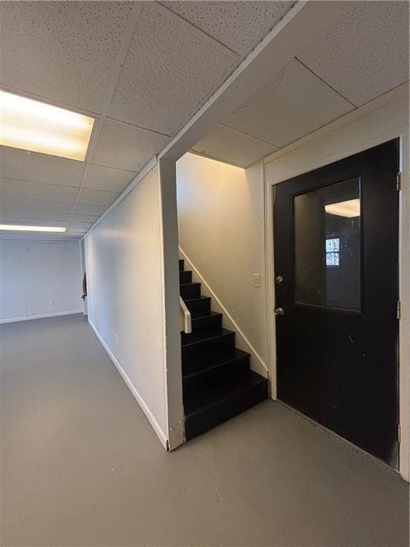 basement featuring a paneled ceiling