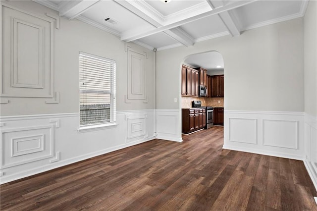 interior space featuring visible vents, dark wood finished floors, arched walkways, and beamed ceiling