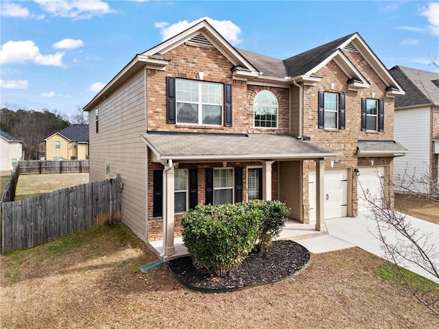 traditional home featuring a shingled roof, covered porch, a garage, fence, and concrete driveway