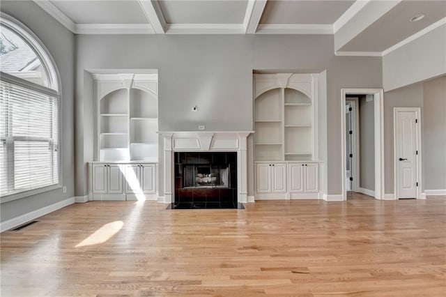 5195 Stefan Ridge Way, Buford, GA 30519 - unfurnished living room featuring built in features, baseboards, visible vents, and light wood-style floors