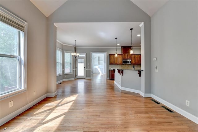 5195 Stefan Ridge Way, Buford, GA 30519 - interior space featuring lofted ceiling, a healthy amount of sunlight, and a chandelier