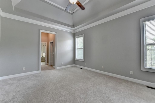 5195 Stefan Ridge Way, Buford, GA 30519 - empty room featuring visible vents, baseboards, a raised ceiling, ceiling fan, and light carpet