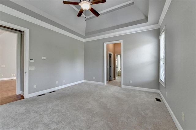 5195 Stefan Ridge Way, Buford, GA 30519 - carpeted spare room featuring a tray ceiling, baseboards, and a ceiling fan