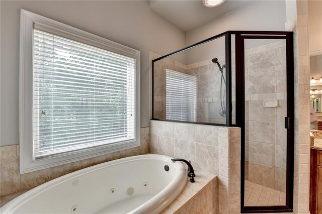 5195 Stefan Ridge Way, Buford, GA 30519 - full bath featuring vanity, a jetted tub, and a stall shower