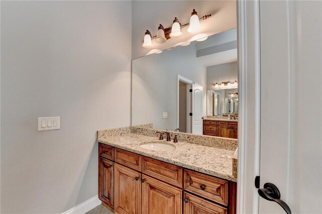 5195 Stefan Ridge Way, Buford, GA 30519 - bathroom with vanity and baseboards