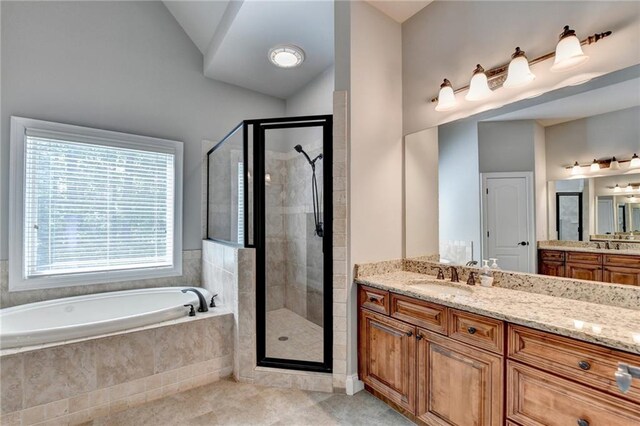 5195 Stefan Ridge Way, Buford, GA 30519 - full bathroom with a garden tub, a stall shower, tile patterned floors, lofted ceiling, and vanity