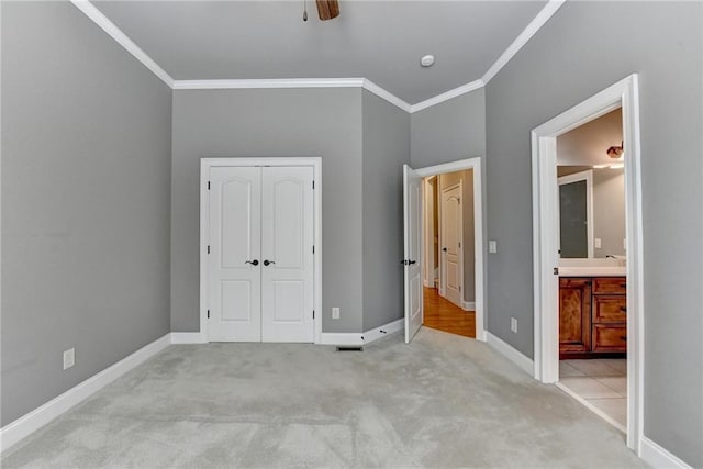 5195 Stefan Ridge Way, Buford, GA 30519 - unfurnished bedroom with a closet, baseboards, ornamental molding, and carpet floors