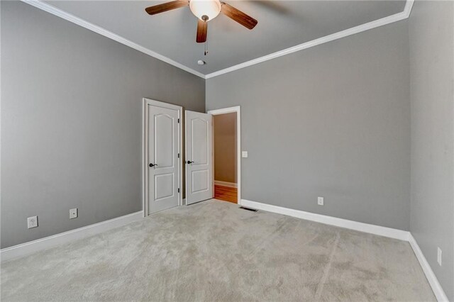 5195 Stefan Ridge Way, Buford, GA 30519 - carpeted empty room featuring ceiling fan, ornamental molding, baseboards, and visible vents